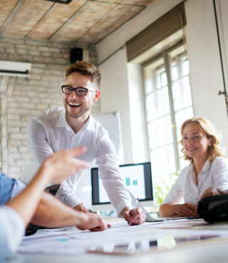 Group of happy colleagues in meeting