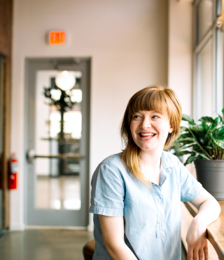 Young woman smiling in office environment