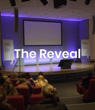 Audience sitting in front of a stage