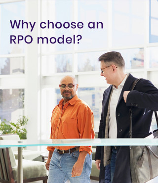 Two men walking and chatting